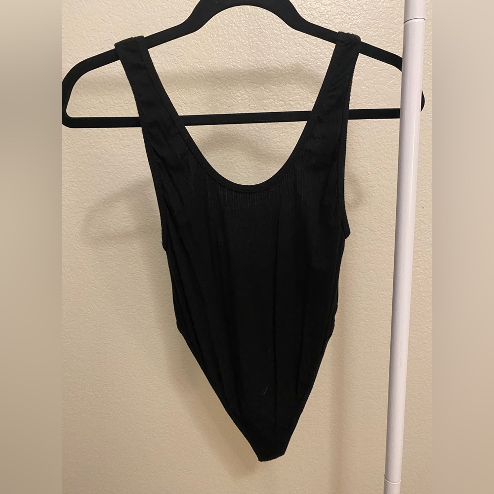 Black bodysuit with low back. Never worn.